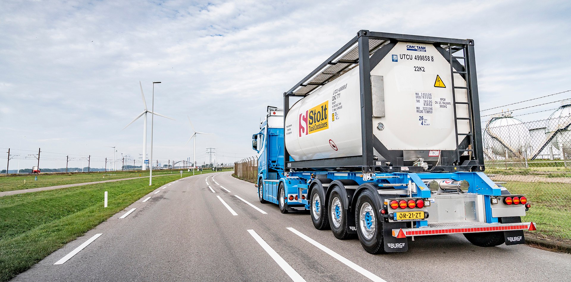 Truck driving with Stolt tank container in the industrial area
