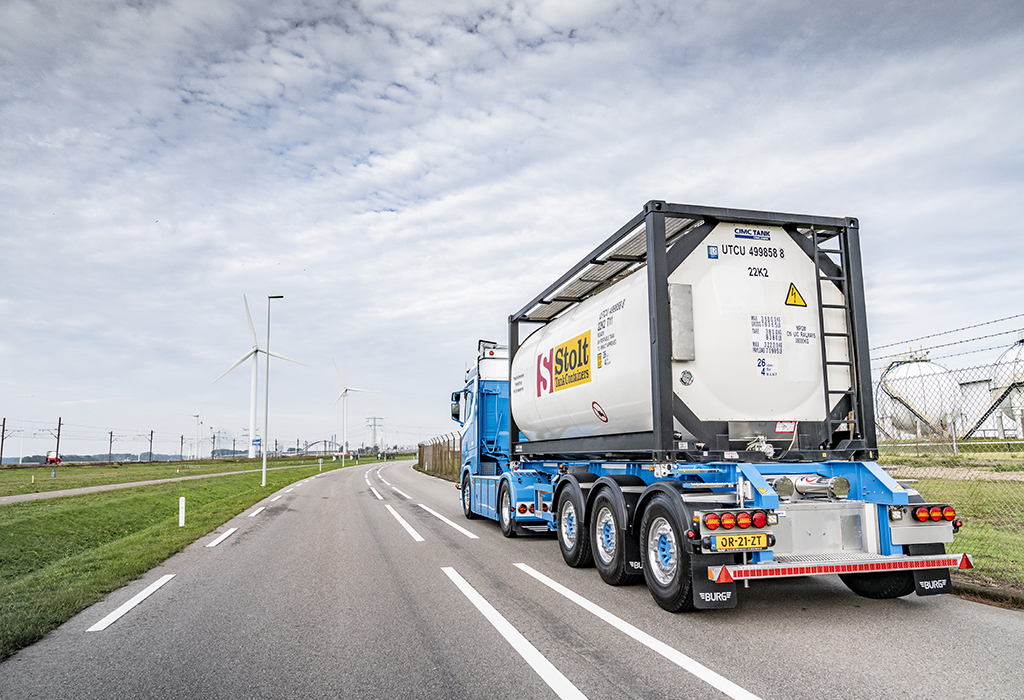 Truck driving with Stolt tank container in the industrial area