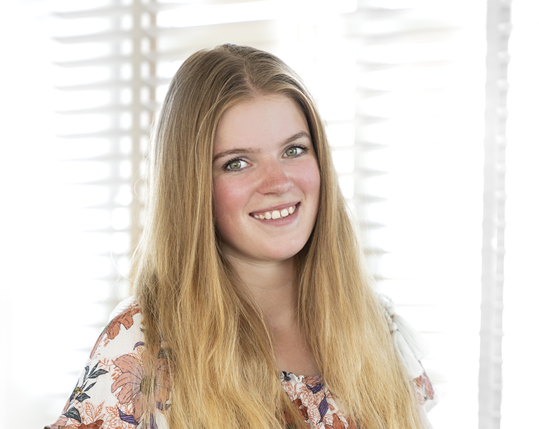 Young intern smiling at camera